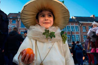 Binche festival carnival in Belgium Brussels. Child dressed with a costume. Music, dance, party and costumes in Binche Carnival. Ancient and representative cultural event of Wallonia, Belgium. The carnival of Binche is an event that takes place each year in the Belgian town of Binche during the Sunday, Monday, and Tuesday preceding Ash Wednesday. The carnival is the best known of several that take place in Belgium at the same time and has been proclaimed as a Masterpiece of the Oral and Intangible Heritage of Humanity listed by UNESCO. Its history dates back to approximately the 14th century.